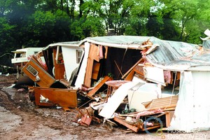 Damaged mobile home after Spring Creek Flood