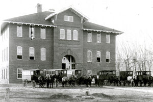 Horse-drawn buses at Cache la Poudre School, circa 1913