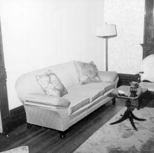 Sofa and table on south wall