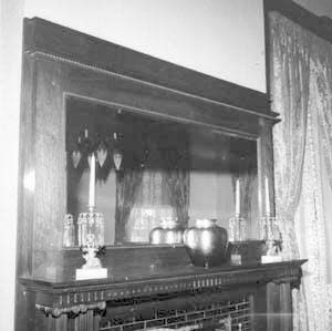 Chair by fireplace in northwest corner