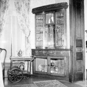 Corner china cabinet and serving cart, southwest corner