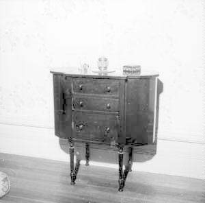 Sewing table on west wall